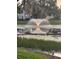 Scenic pond with fountain provides tranquil views, enhancing the community's natural beauty at 10346 Carrollwood Ln # 171, Tampa, FL 33618