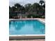 Enjoy this community pool with plenty of lounge seating and well-maintained landscaping at 10346 Carrollwood Ln # 171, Tampa, FL 33618