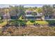 Backyard view features a screen enclosed pool with lush landscaping near the water at 11713 Summer Springs Dr, Riverview, FL 33579