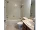 Full bathroom with tiled tub and shower combination and vanity at 11713 Summer Springs Dr, Riverview, FL 33579