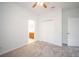 Neutral bedroom featuring carpeted floors, a closet, and a door to the ensuite bathroom at 11713 Summer Springs Dr, Riverview, FL 33579