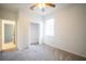 Bright bedroom with closet, carpet flooring and window overlooking the backyard at 11713 Summer Springs Dr, Riverview, FL 33579