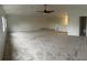 Spacious bonus room with carpeted floors, neutral paint, and a ceiling fan at 11713 Summer Springs Dr, Riverview, FL 33579