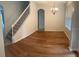 Bright dining room featuring wood floors and a modern chandelier at 11713 Summer Springs Dr, Riverview, FL 33579