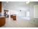 Open kitchen concept featuring wood cabinets, stainless steel appliances, a breakfast bar, and a tile floor at 11713 Summer Springs Dr, Riverview, FL 33579