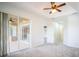 Spacious living room features glass doors to the lanai, and a ceiling fan, perfect for entertaining guests at 11713 Summer Springs Dr, Riverview, FL 33579