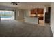 Spacious living room with pool access, connected to a kitchen at 11713 Summer Springs Dr, Riverview, FL 33579