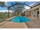 Enclosed pool with palm trees providing shade and privacy at 11713 Summer Springs Dr, Riverview, FL 33579