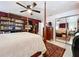 Bright and airy main bedroom with ceiling fan, mirrored closets and four poster bed at 1282 Palm St, Clearwater, FL 33755