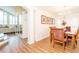 Open-concept dining room featuring wood floors and chandelier at 18934 Avenue Biarritz, Lutz, FL 33558
