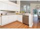 Bright kitchen with stainless steel appliances, granite countertops, and backyard view at 18934 Avenue Biarritz, Lutz, FL 33558