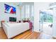 Spacious living room featuring a large sectional sofa and views of the outdoor pool area at 18934 Avenue Biarritz, Lutz, FL 33558