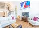 Inviting living room features wood floors, comfortable seating, and a staircase to the upper level at 18934 Avenue Biarritz, Lutz, FL 33558
