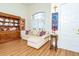 Comfortable living room with wood floors, built-in display, and lots of natural light at 18934 Avenue Biarritz, Lutz, FL 33558