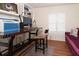 Comfortable office space featuring a desk and sofa at 18934 Avenue Biarritz, Lutz, FL 33558