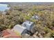 Expansive aerial view showcasing a home surrounded by a dense forest landscape at 2508 W Shell Point Rd, Tampa, FL 33611