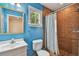 Stylish bathroom with tiled shower, window and updated vanity at 2508 W Shell Point Rd, Tampa, FL 33611