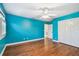 Spacious bedroom with hardwood floors and a double-door closet at 2508 W Shell Point Rd, Tampa, FL 33611