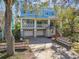 Elegant two-story home featuring a double garage, dual balconies, and manicured landscaping at 2508 W Shell Point Rd, Tampa, FL 33611