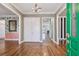 Spacious foyer with decorative hardwood floors and views into other rooms at 2508 W Shell Point Rd, Tampa, FL 33611