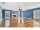 Spacious living room with hardwood floors, fireplace and bright natural light coming in from multiple windows at 2508 W Shell Point Rd, Tampa, FL 33611