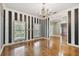 Bright living room featuring hardwood floors, stylish black & white striped walls and bright windows at 2508 W Shell Point Rd, Tampa, FL 33611