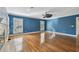 View of a large main bedroom with hardwood floors and a fireplace at 2508 W Shell Point Rd, Tampa, FL 33611