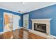 This is a spacious main bedroom featuring hardwood floors and a cozy fireplace at 2508 W Shell Point Rd, Tampa, FL 33611