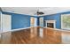 Spacious main bedroom with a fireplace, ceiling fan, and hardwood floors at 2508 W Shell Point Rd, Tampa, FL 33611