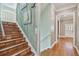 Unique staircase with terracotta tile steps, wood plank wall art, and natural light at 2508 W Shell Point Rd, Tampa, FL 33611