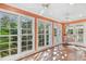 Inviting sunroom with lots of windows, terracotta floors, and casual seating, perfect for relaxing at 2508 W Shell Point Rd, Tampa, FL 33611