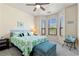 Bright bedroom with bay window and decorative botanical-themed bedding at 2717 Via Cipriani # 620A, Clearwater, FL 33764