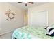 Cozy bedroom featuring a decorative floral mirror and a large closet at 2717 Via Cipriani # 620A, Clearwater, FL 33764