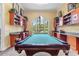 Well-appointed game room with pool table, custom built-ins and natural light at 2717 Via Cipriani # 620A, Clearwater, FL 33764
