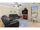 Comfortable living room features a fireplace, ceiling fan, and plenty of natural light at 2717 Via Cipriani # 620A, Clearwater, FL 33764