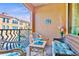 Inviting covered patio with comfortable seating and a view of surrounding buildings at 2717 Via Cipriani # 620A, Clearwater, FL 33764