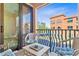 Cozy outdoor patio seating area offering relaxing views of the community and blue skies at 2717 Via Cipriani # 620A, Clearwater, FL 33764