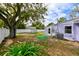 This spacious backyard has a lush lawn and privacy fence at 3302 W Van Buren Dr, Tampa, FL 33611