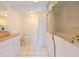Well-lit bathroom with clean fixtures, including a tub and vanity, ensuring a comfortable and functional space at 3302 W Van Buren Dr, Tampa, FL 33611