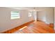 Serene bedroom featuring wood floors and natural light, providing a relaxing retreat for rest and rejuvenation at 3302 W Van Buren Dr, Tampa, FL 33611