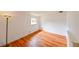 This bedroom has wood-look flooring and a bright window at 3302 W Van Buren Dr, Tampa, FL 33611