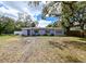 Charming single-story home featuring a pleasant color scheme and a well-maintained front lawn at 3302 W Van Buren Dr, Tampa, FL 33611
