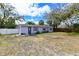 Inviting single-story home with a tidy lawn, showcasing a cozy and well-kept exterior at 3302 W Van Buren Dr, Tampa, FL 33611