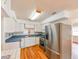 Functional kitchen with stainless steel appliances, ample cabinet space, and sleek countertops for easy meal preparation at 3302 W Van Buren Dr, Tampa, FL 33611
