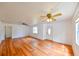 Bright and airy living room with wood floors, ceiling fans, and natural light, creating a comfortable and inviting atmosphere at 3302 W Van Buren Dr, Tampa, FL 33611