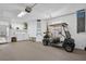 Spacious garage with golf cart, washer, and dryer at 3493 Somerset Ct, Palm Harbor, FL 34684