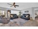 Comfortable living room with tile floors, ceiling fan and relaxing seating arrangement at 3493 Somerset Ct, Palm Harbor, FL 34684