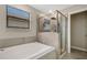 Bright bathroom featuring a soaking tub and separate glass-enclosed shower at 3568 Pine Ribbon Dr, Land O Lakes, FL 34638