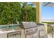 Close up of stainless steel outdoor kitchen under covered patio at 416 Shore E Dr, Oldsmar, FL 34677