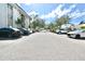 Exterior image of a fully packed parking lot on a sunny day in front of the building at 4610 W Gray St # 208, Tampa, FL 33609